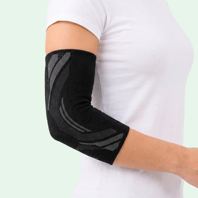 Kompressionsärm för armbåge med stödjande passform som ger stabilitet och avlastning vid aktivitet och vardag.