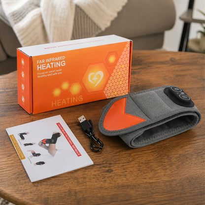 Handledsband med rödljusterapi, värme och vibrationsmassage tillsammans med laddkabel, manual och förpackning.
