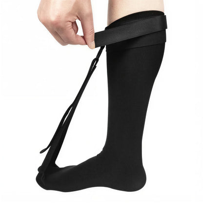 Stretchsocka med justerbart band runt underbenet.