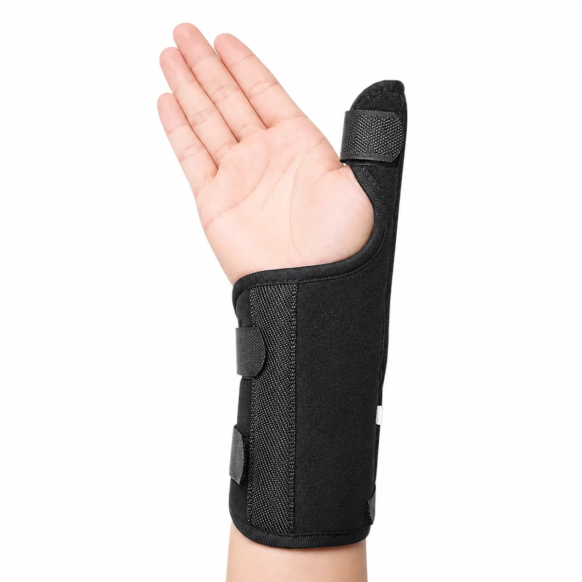 Handledsstöd med tumstöd som stabiliserar handled och tumme med justerbara kardborreband.